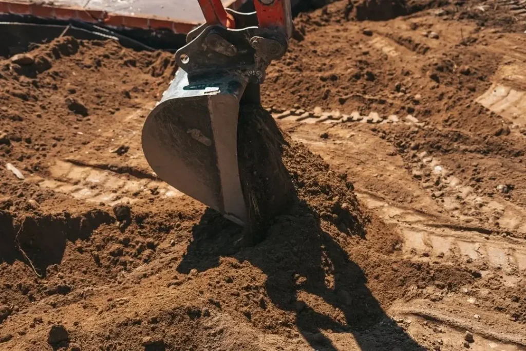 Backhoe digging soil