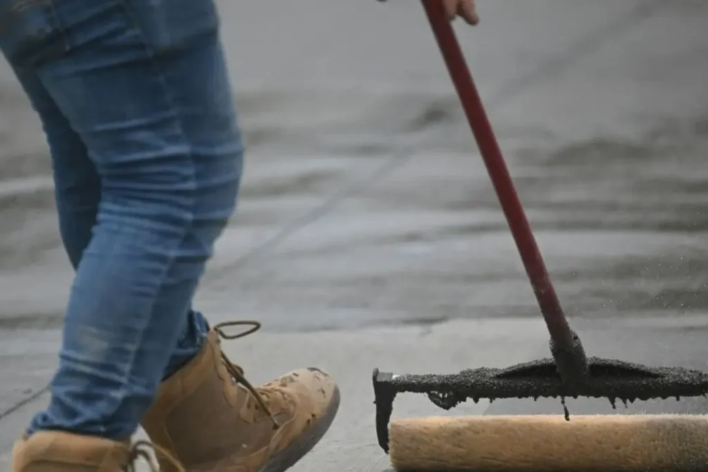 concreter sealing a driveway